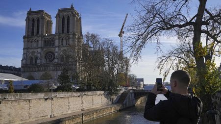 A man watches the reconstruction work